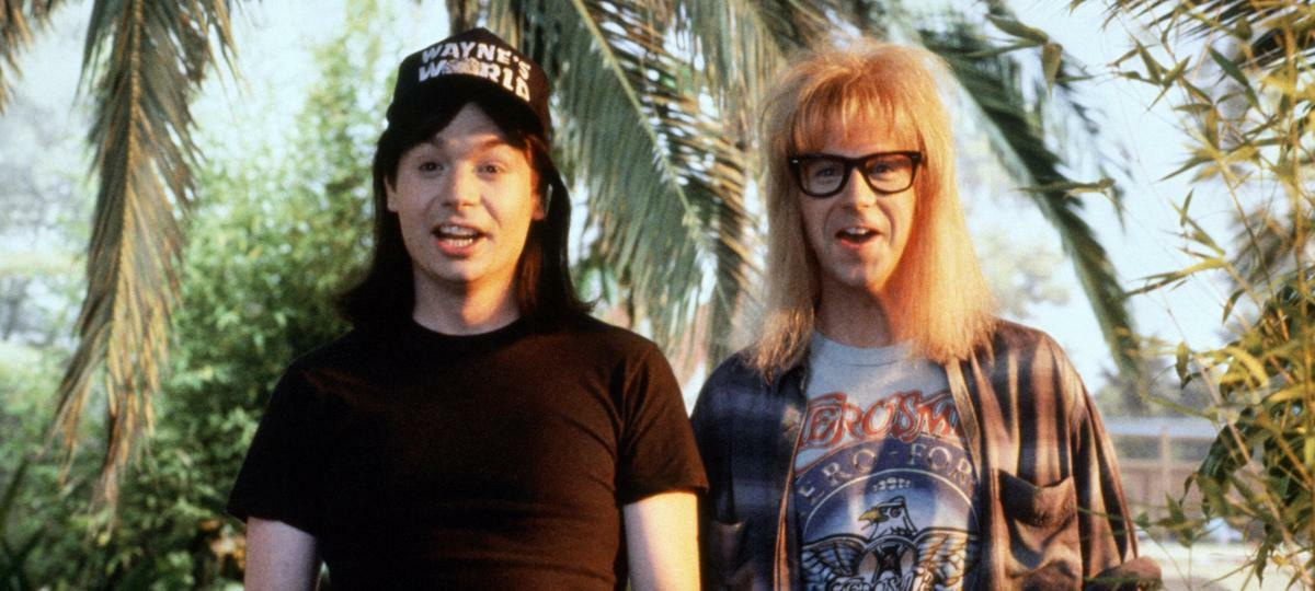 Wayne and Garth stood next to each other looking cheerful.